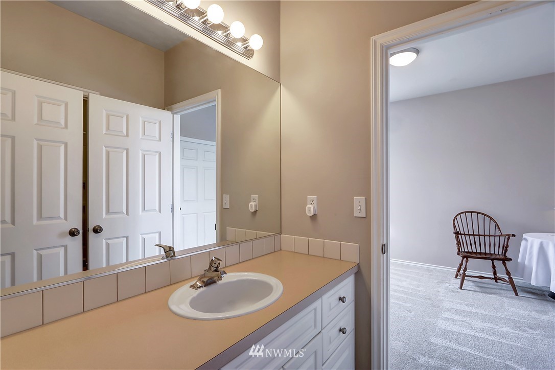 17013 Parkside Way Southeast Renton, WA 98058 - Photo 21 of 26 a bathroom with a sink and a mirror