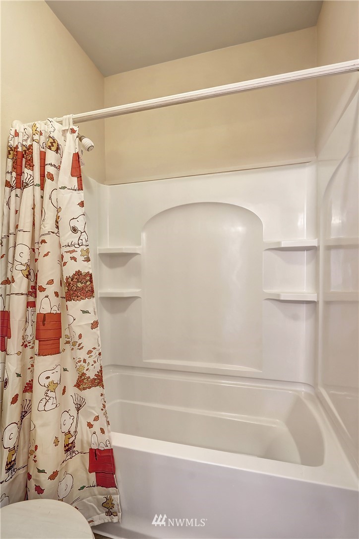 17013 Parkside Way Southeast Renton, WA 98058 - Photo 22 of 26 a bathroom with a bathtub and shower