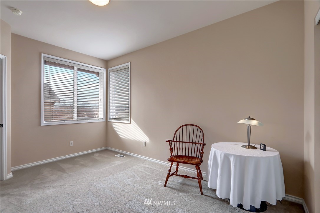 17013 Parkside Way Southeast Renton, WA 98058 - Photo 23 of 26 a bedroom with furniture and a window