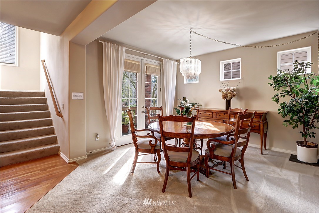 17013 Parkside Way Southeast Renton, WA 98058 - Photo 4 of 26 a view of a dining room with furniture and wooden floor