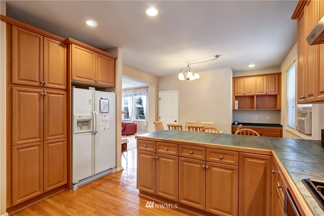 17013 Parkside Way Southeast Renton, WA 98058 - Photo 8 of 26 a kitchen with stainless steel appliances granite countertop a refrigerator and a sink