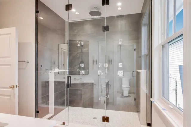 a bathroom with a shower and a tub