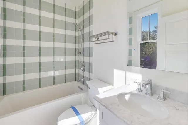 a view of room with window and wooden floor