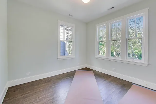 a bathroom with a sink mirror and toilet