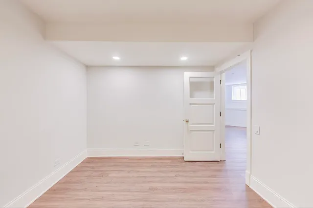 a bathroom with a sink toilet vanity and shower