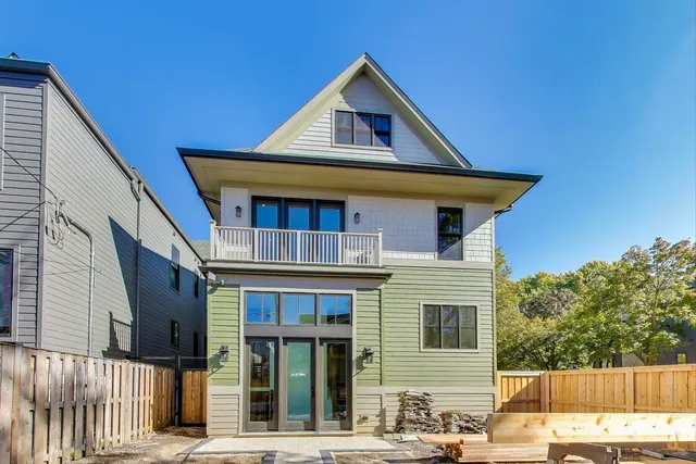 a backyard of a house with outdoor seating