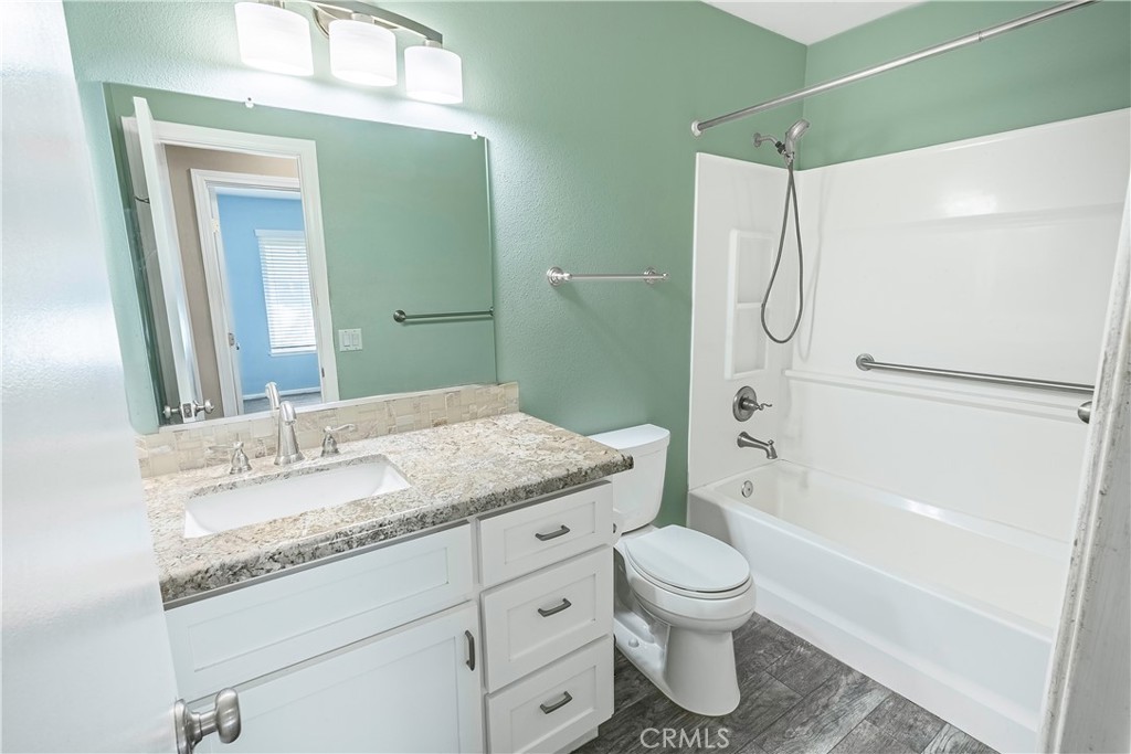 2415 Peppertree Lane Riverside, CA 92506 - Photo 15 of 39 a bathroom with a granite countertop sink toilet and shower