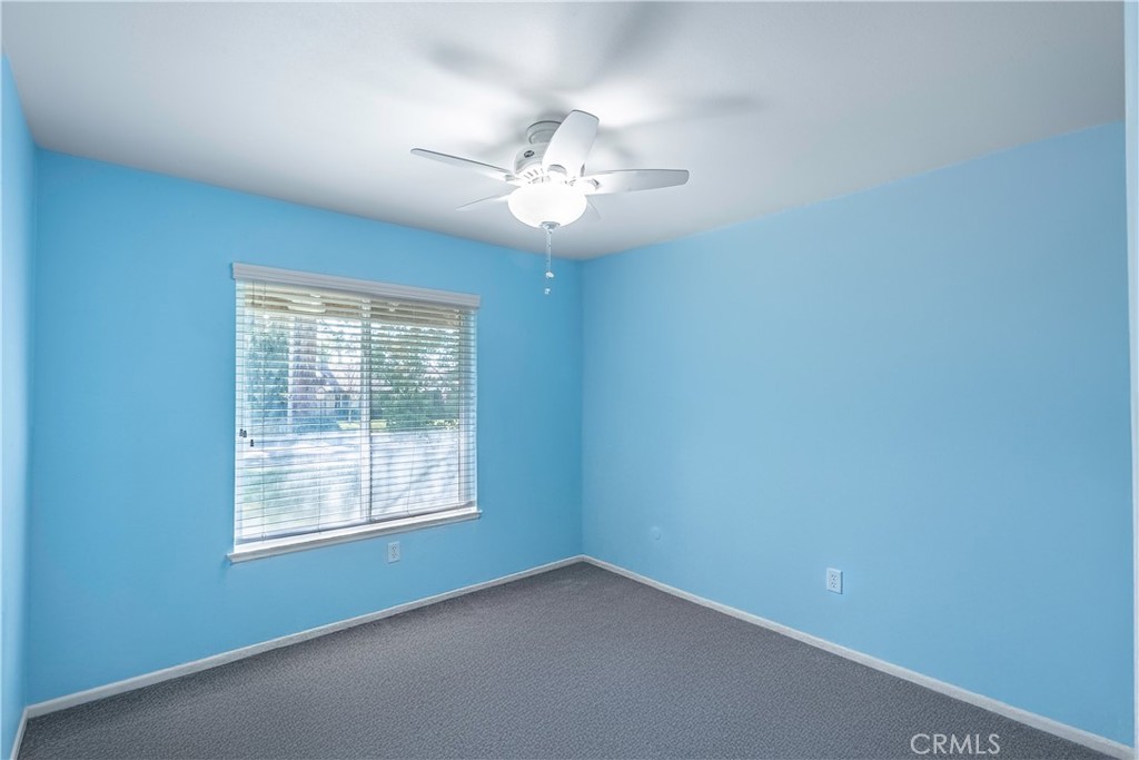 2415 Peppertree Lane Riverside, CA 92506 - Photo 17 of 39 an empty room with a window and a fan