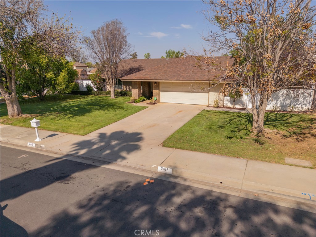 2415 Peppertree Lane Riverside, CA 92506 - Photo 28 of 39 a front view of a house with a yard
