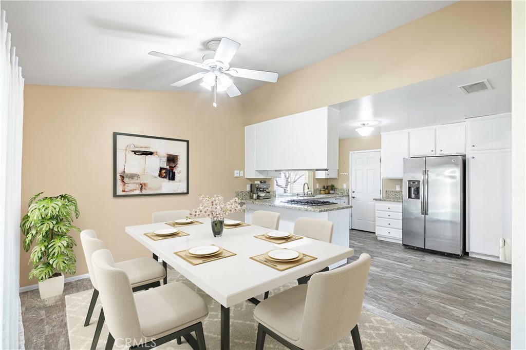2415 Peppertree Lane Riverside, CA 92506 - Photo 10 of 39 a view of a dining room with furniture and wooden floor