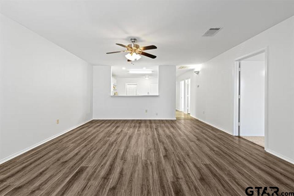1807 Paverstone Lane Longview, TX 75605 - Photo 20 of 37 wooden floor in an empty room with a window