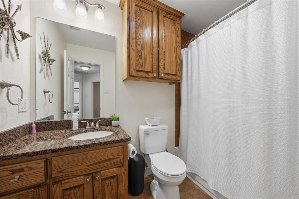 5262 Rio Vista Malakoff, TX 75148 - Photo 15 of 29 a bathroom with a granite countertop sink toilet and mirror