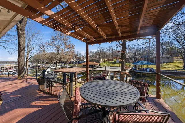 a view of a patio with table and chairs