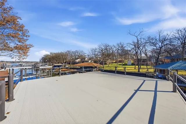 a view of swimming pool with outdoor seating and city view