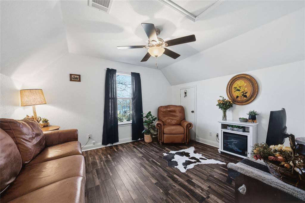 5262 Rio Vista Malakoff, TX 75148 - Photo 29 of 29 a living room with furniture a flat screen tv and a fireplace
