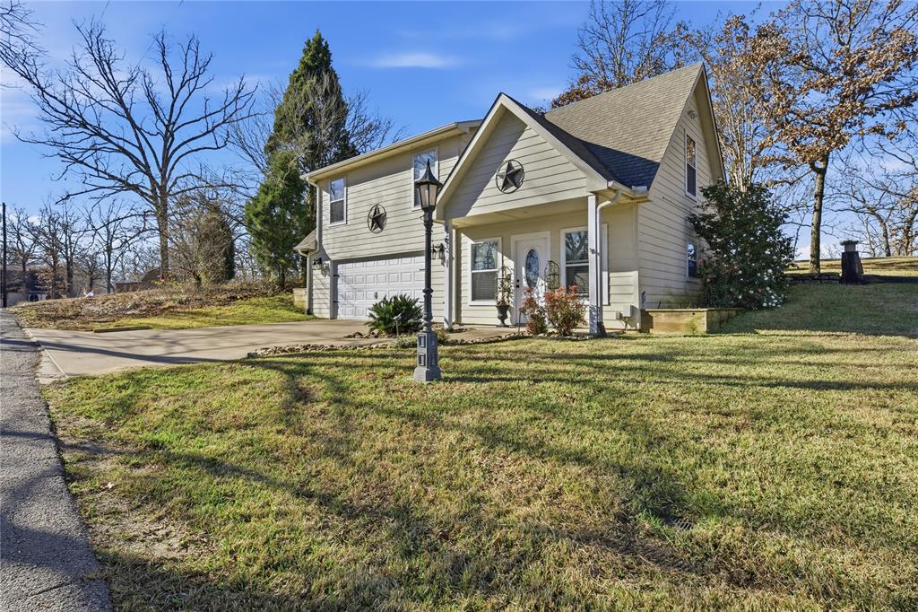 5262 Rio Vista Malakoff, TX 75148 - Photo 4 of 29 a front view of a house with garden