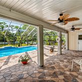 a view of a porch with furniture and garden