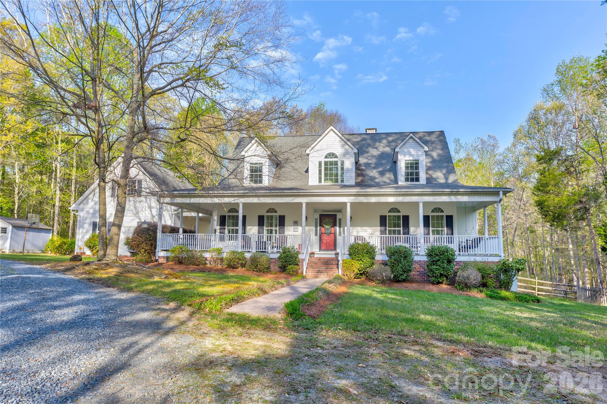 2715 Tabitha Lane Concord, NC 28025 - Photo 1 of 41 a front view of a house with a yard table and chairs
