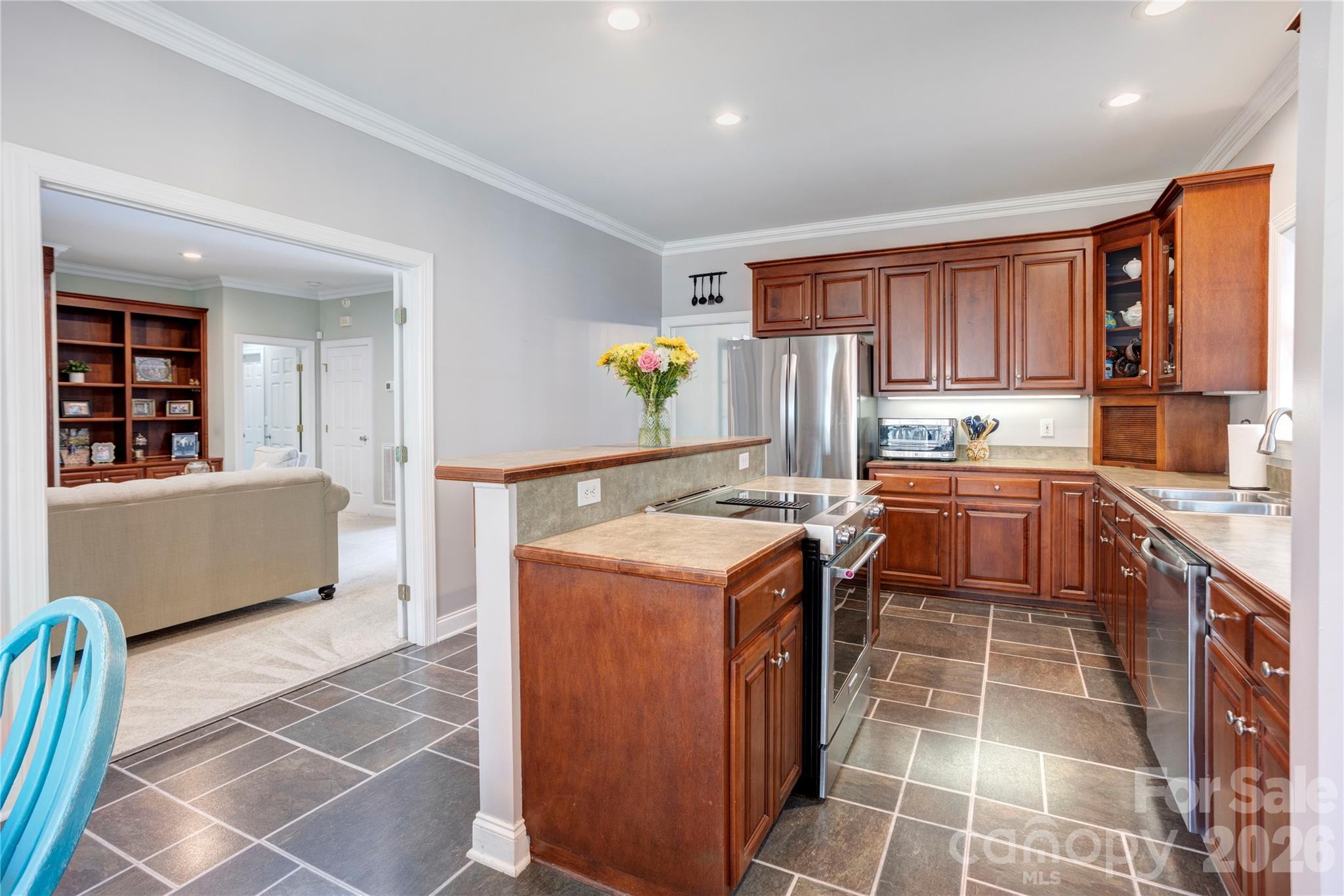 2715 Tabitha Lane Concord, NC 28025 - Photo 12 of 41 a kitchen with a stove a sink and a refrigerator