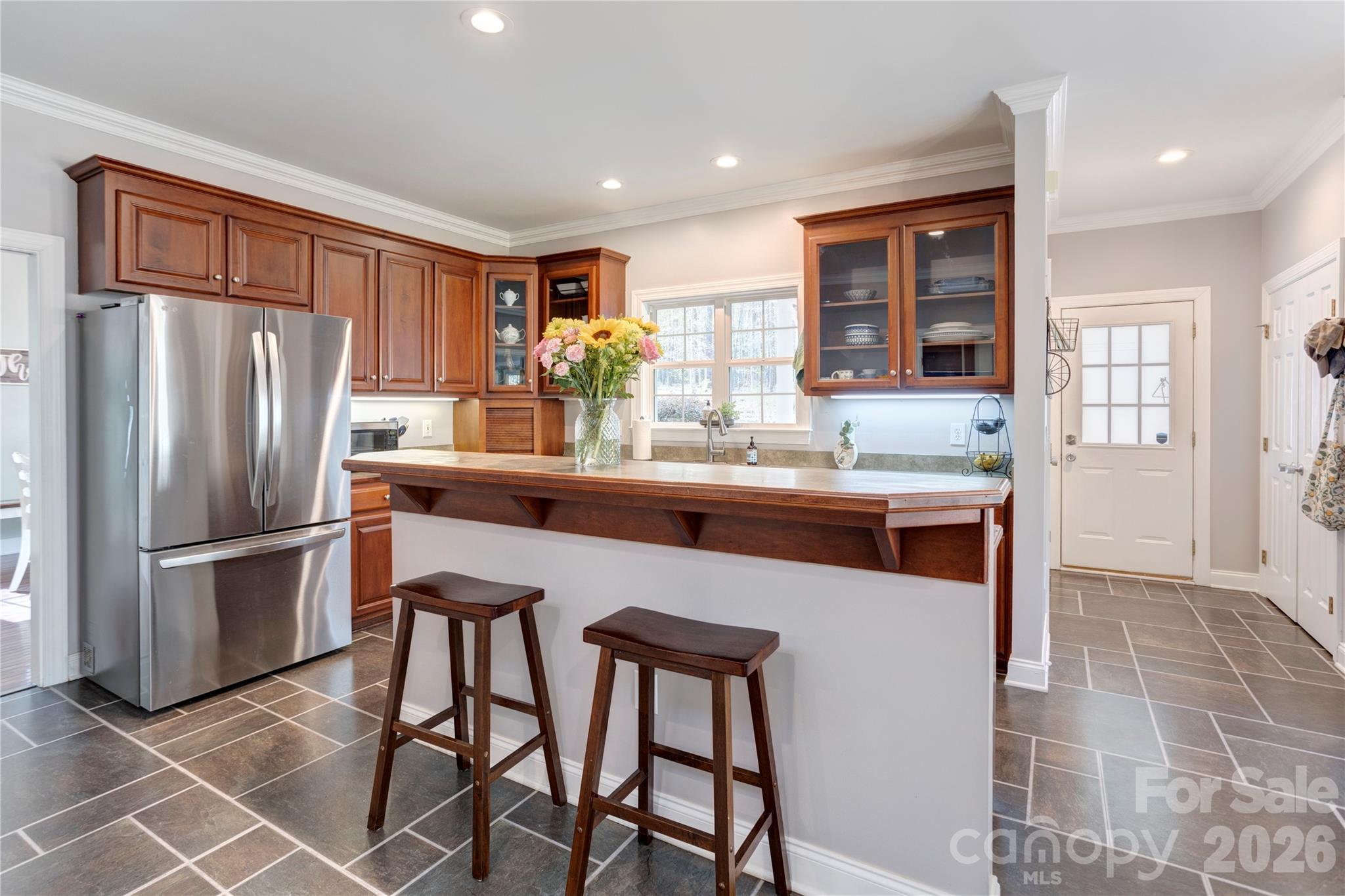 2715 Tabitha Lane Concord, NC 28025 - Photo 14 of 41 a kitchen with stainless steel appliances granite countertop a refrigerator a sink a stove and island