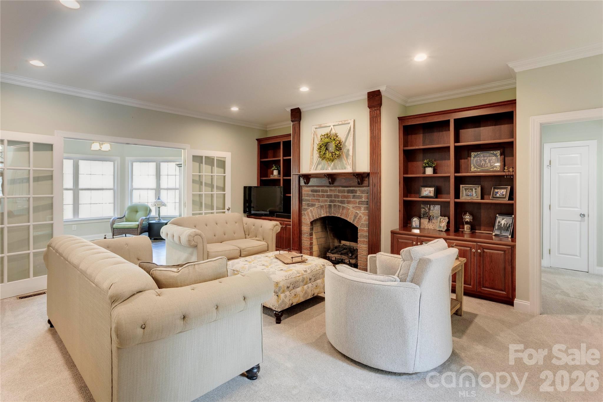 2715 Tabitha Lane Concord, NC 28025 - Photo 18 of 41 a living room with furniture and a fireplace