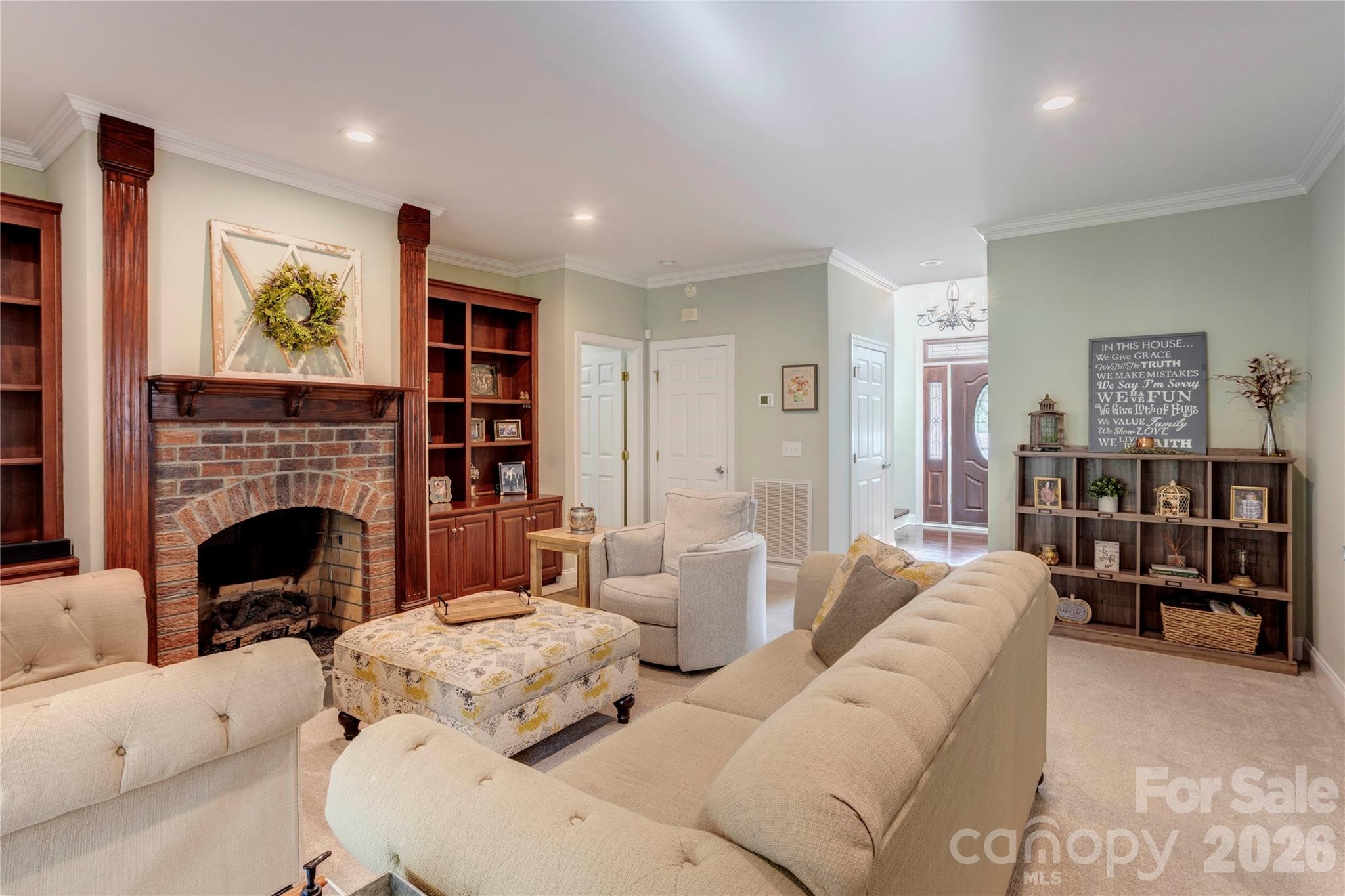 2715 Tabitha Lane Concord, NC 28025 - Photo 20 of 41 a living room with furniture and a fireplace