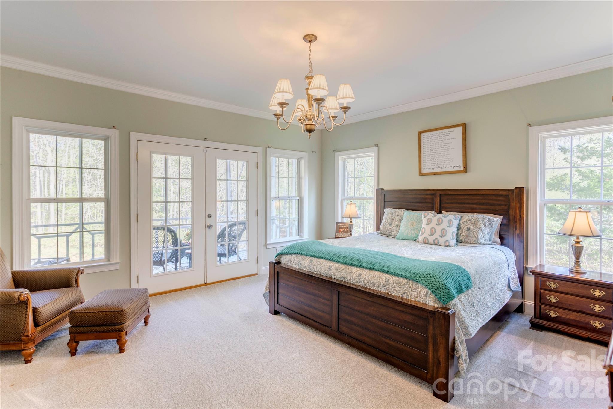 2715 Tabitha Lane Concord, NC 28025 - Photo 22 of 41 a spacious bedroom with a bed and a chandelier