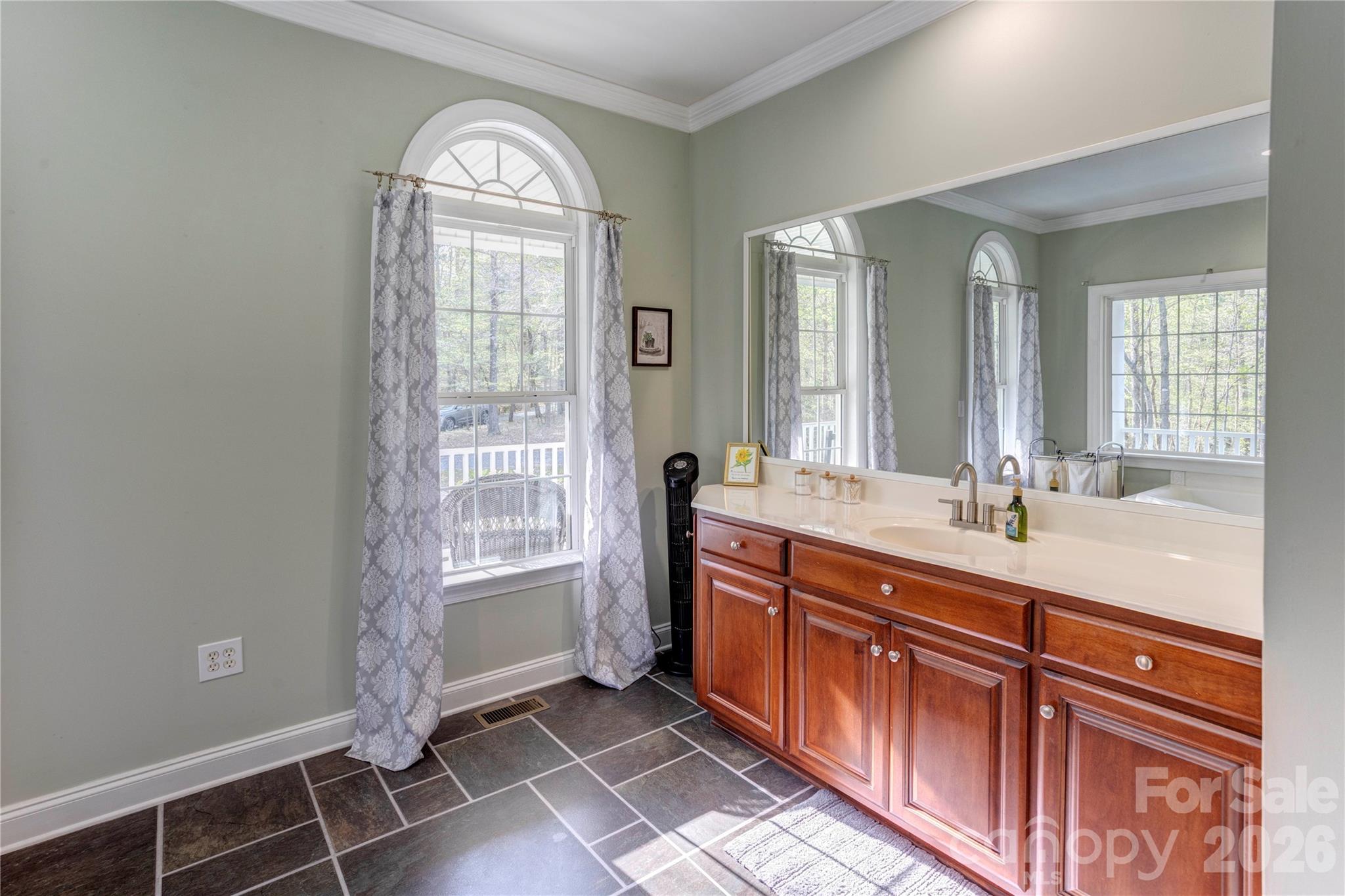 2715 Tabitha Lane Concord, NC 28025 - Photo 25 of 41 a spacious bathroom with double vanity and a mirror