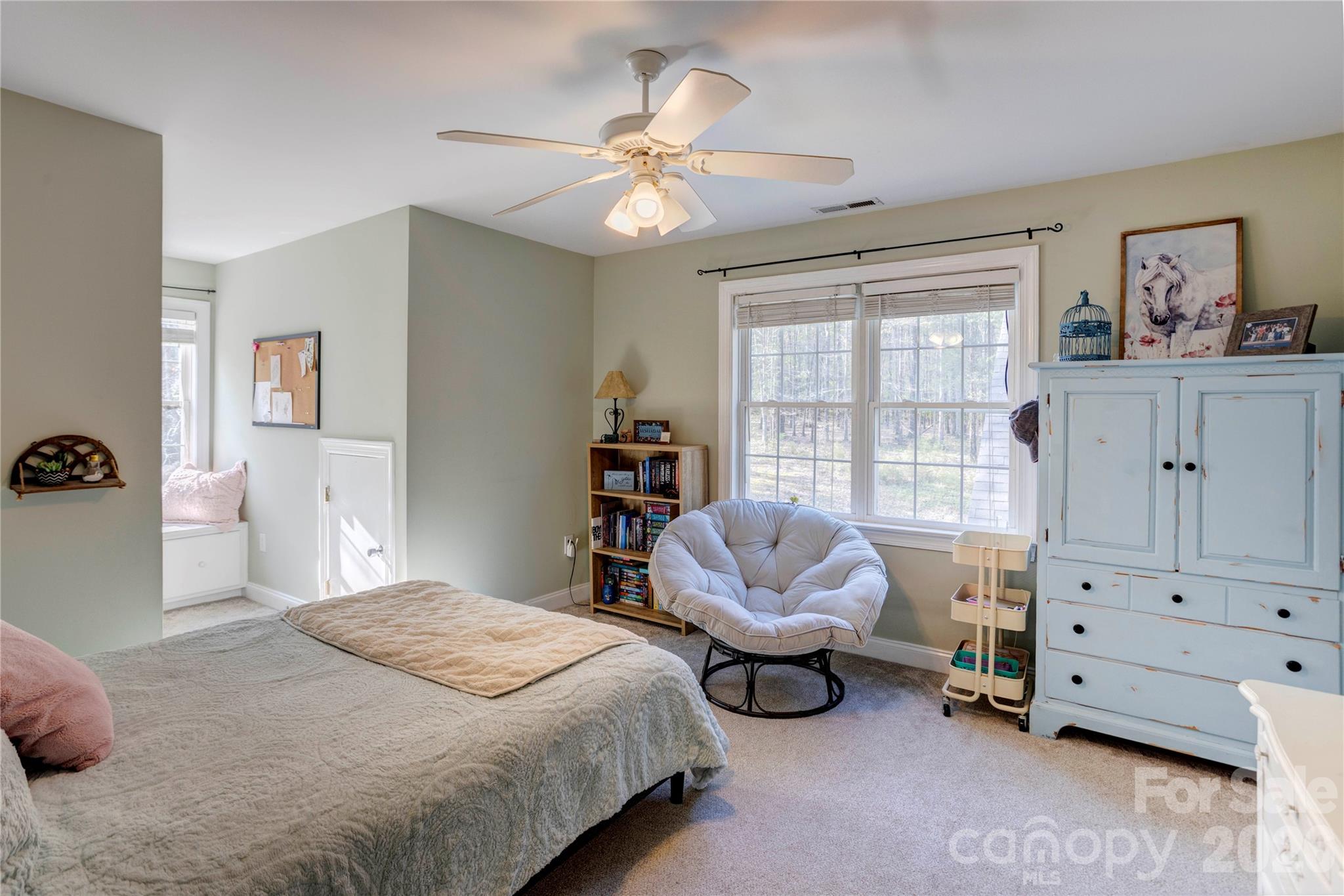 2715 Tabitha Lane Concord, NC 28025 - Photo 31 of 41 a bedroom with a bed and a chandelier