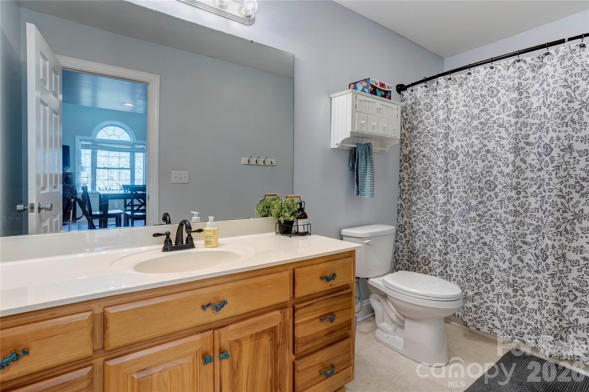 2715 Tabitha Lane Concord, NC 28025 - Photo 33 of 41 a bathroom with a sink toilet and mirror