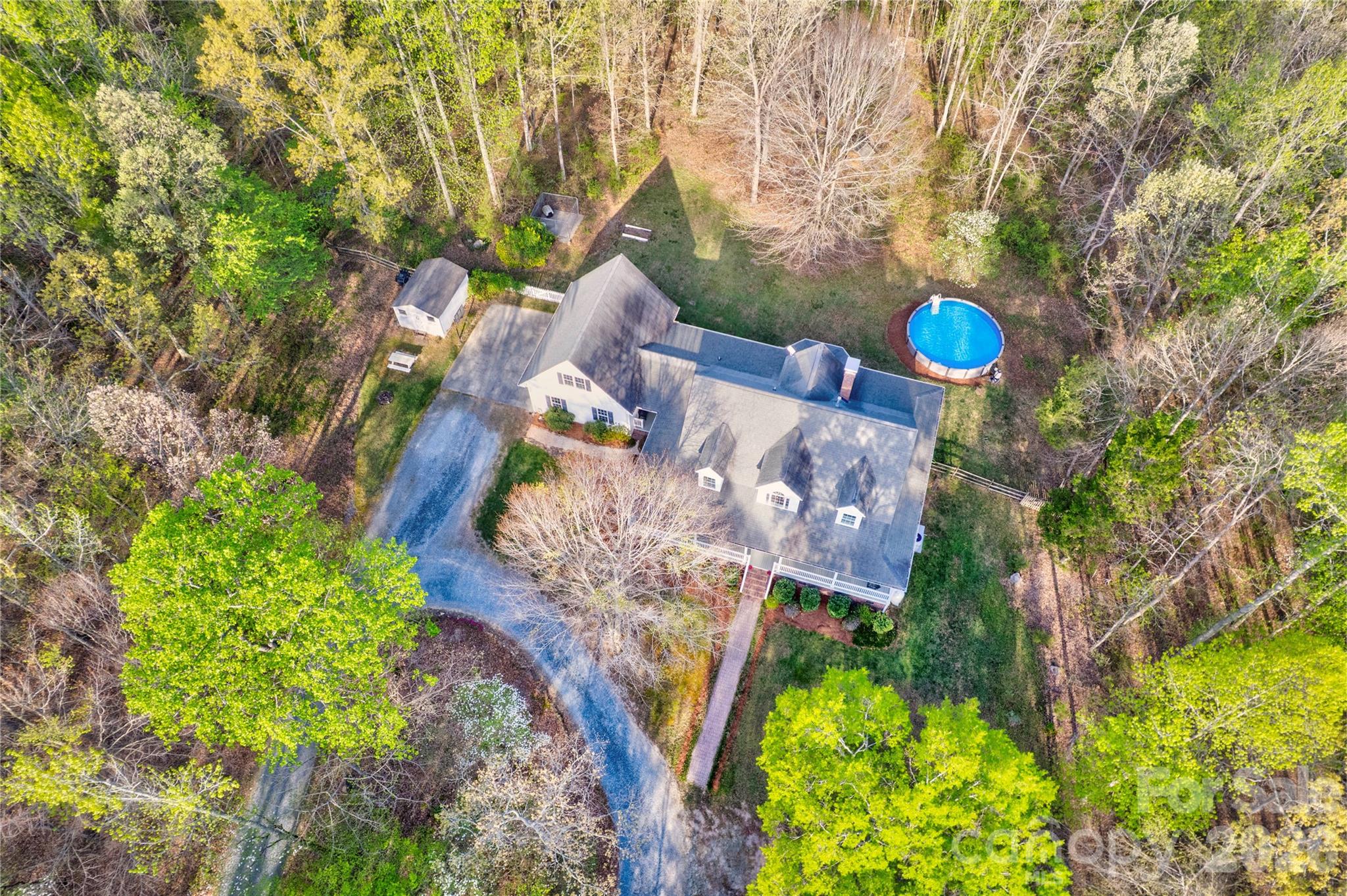 2715 Tabitha Lane Concord, NC 28025 - Photo 4 of 41 a view of a house with a yard and garden