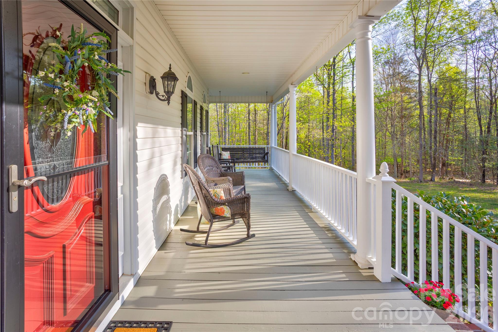 2715 Tabitha Lane Concord, NC 28025 - Photo 6 of 41 a view of a balcony with wooden floor and iron stairs