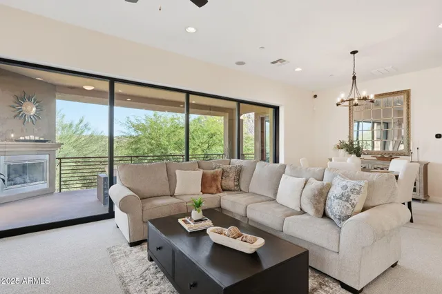 a large white kitchen with a large window