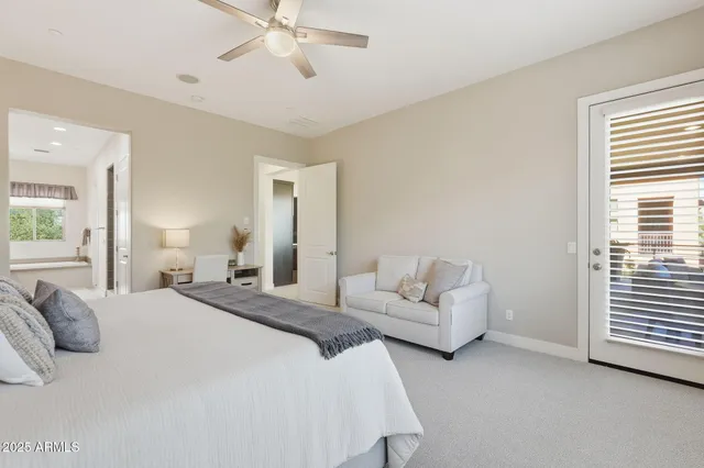 a bathroom with a granite countertop sink double vanity and a mirror