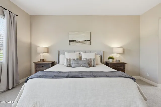 a view of walk in closet with clothes