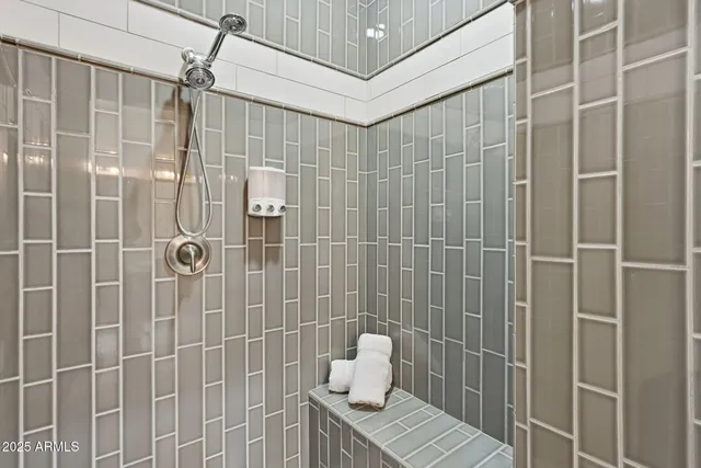 a bathroom with a granite countertop toilet sink and mirror