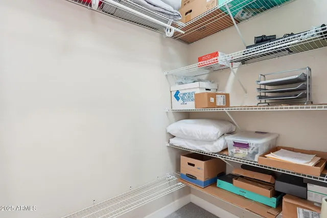 a bathroom with a granite countertop sink toilet a mirror and shower