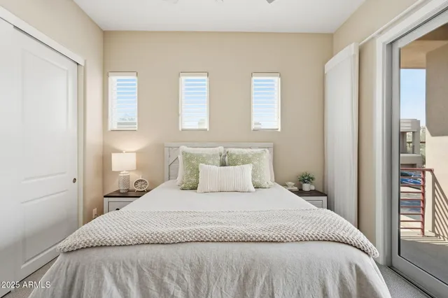an aerial view of a house with a yard and a large tree