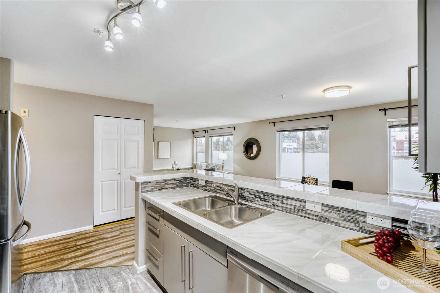 10511 Midvale Avenue North, Unit 302 Seattle, WA 98133 - Photo 11 of 24 a view of a kitchen with a sink and cabinets