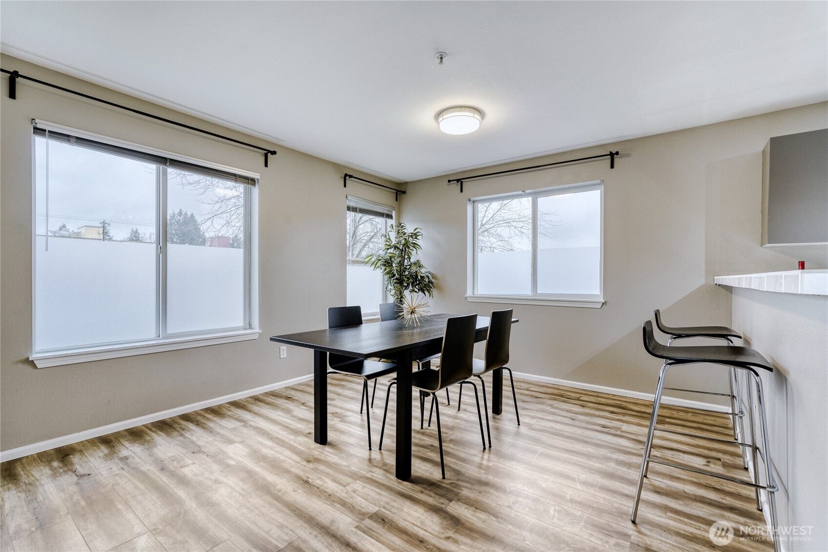 10511 Midvale Avenue North, Unit 302 Seattle, WA 98133 - Photo 14 of 24 a view of a dining room with furniture and window