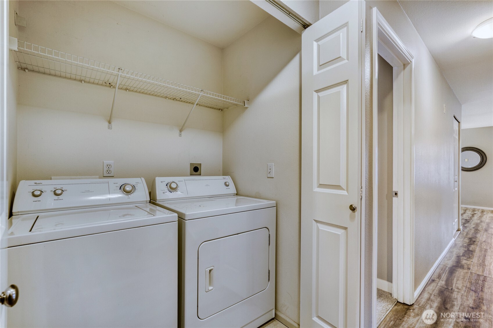 10511 Midvale Avenue North, Unit 302 Seattle, WA 98133 - Photo 23 of 24 a view of storage and utility room with dryer and washer