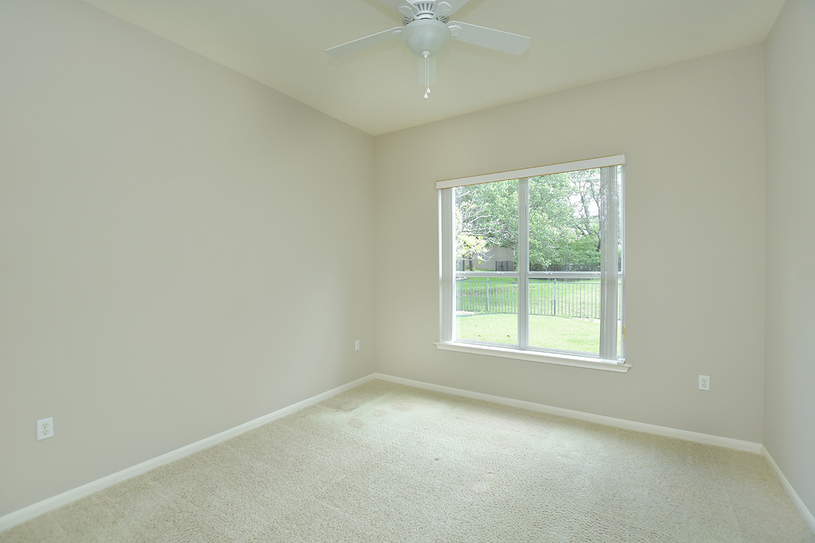 114 Lone Star Drive Georgetown, TX 78633 - Photo 25 of 30 On the opposite side of the home from the primary bedroom, the quiet guest bedroom offers serene outdoor views.