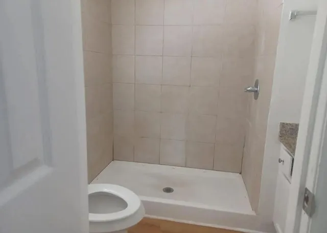 a bathroom with a bathtub and a toilet