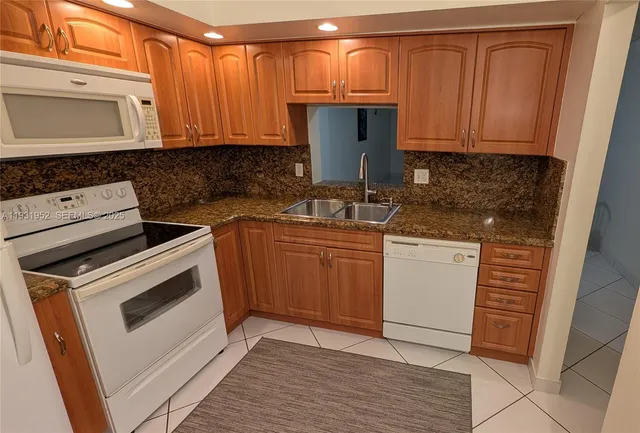 a kitchen with a stove and a microwave