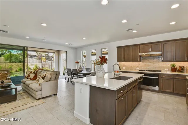 a large kitchen with stainless steel appliances lots of counter top space