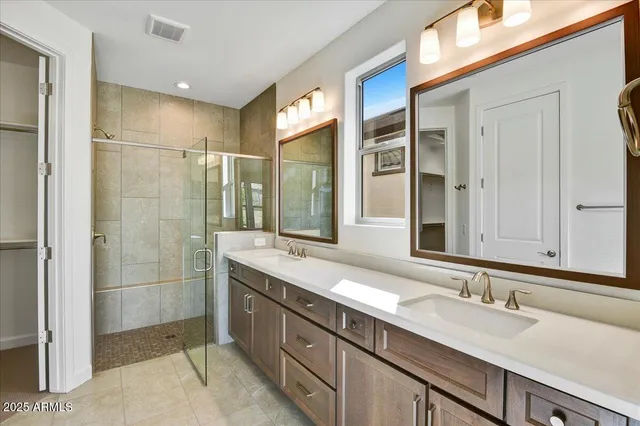 a bathroom with a double vanity sink mirror and double
