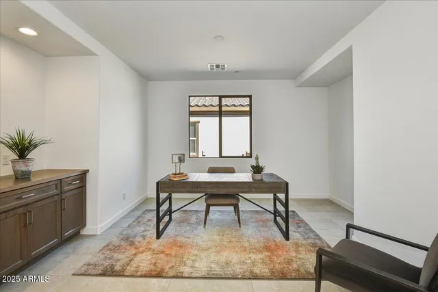 a workspace with furniture and window