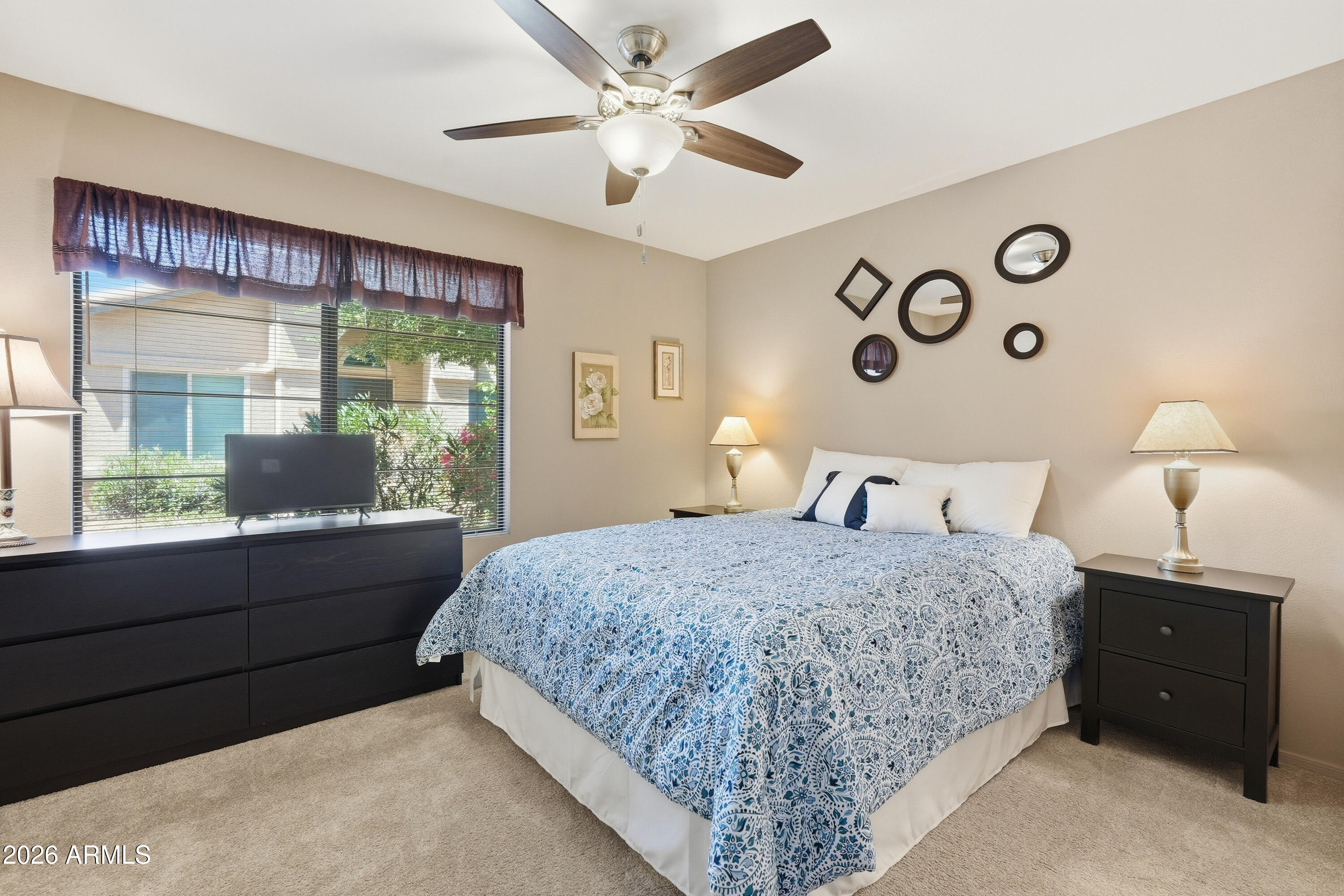 14300 West Bell Road, Unit 387 Surprise, AZ 85374 - Photo 11 of 18 a bedroom with a large bed and a window