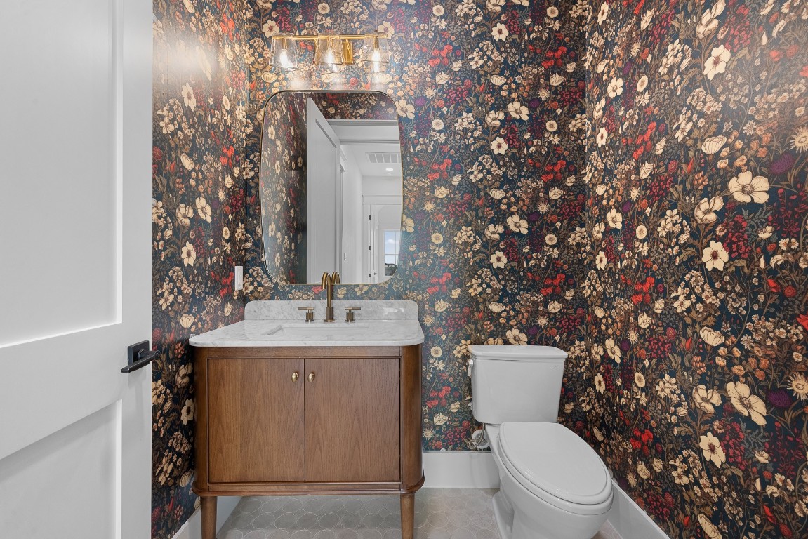 424 Pleasant Hill School Road Brenham, TX 77833 - Photo 13 of 26 a bathroom with a toilet sink and mirror