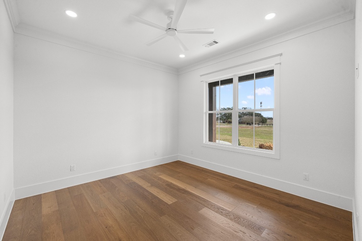 424 Pleasant Hill School Road Brenham, TX 77833 - Photo 15 of 26 an empty room with a window and a ceiling fan